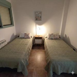 Ένα ή περισσότερα κρεβάτια σε δωμάτιο στο Trelew Cartref