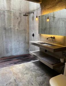 a bathroom with a sink and a mirror at Nativo Tayrona in Santa Marta