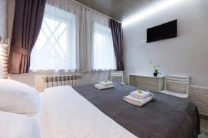 Postel nebo postele na pokoji v ubytování Smart Hotel Rooms near metro 24/7 + 9 fotografií