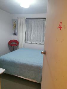 Postel nebo postele na pokoji v ubytování CHC Townhouse + 4 fotografie