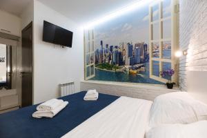 Postel nebo postele na pokoji v ubytování Smart Hotel Rooms near metro 24/7