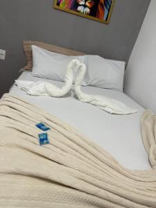 En eller flere senge i et værelse på Pousada Canto das Lagoas