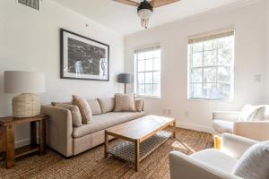 a living room with a couch and a table at Kasa Wellington South Florida in Wellington