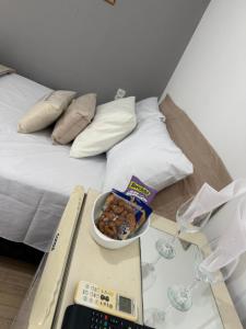 En eller flere senge i et værelse på Pousada Canto das Lagoas