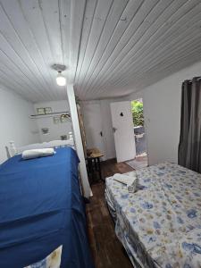 Ένα ή περισσότερα κρεβάτια σε δωμάτιο στο Pousada Nova Brasília Ilha do Mel