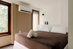 En eller flere senge i et værelse på Casa Bonfim - Excelente opção no centro de Arraial