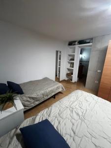 a bedroom with two beds in a room at Oasis de paz junto al mar in Maspalomas