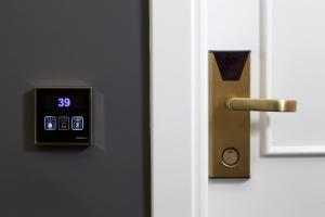 a close up of a door with a clock on it at Anaktorikon Boutique Hotel in Tripoli