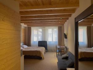 Postel nebo postele na pokoji v ubytování New Gudauri La Suites + 12 fotografií