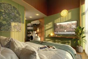 a bedroom with a bed with a tv on the wall at Still apartment in Guangzhou +27 photos