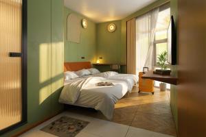 a bedroom with two beds and a window at Still apartment in Guangzhou
