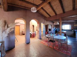 a large room with a table and a kitchen at La Chakana in Cachí