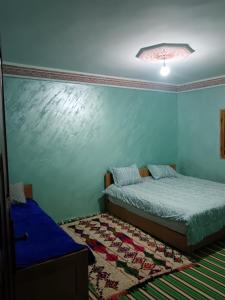 Postel nebo postele na pokoji v ubytování Gite Atlas Imzoughe