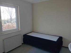 Ένα ή περισσότερα κρεβάτια σε δωμάτιο στο Holiday home in Heeg with swimming pool