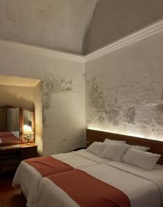 Postel nebo postele na pokoji v ubytování Hotel Piru Wasi