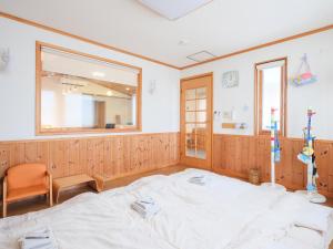 Postel nebo postele na pokoji v ubytování Urayasu Horie House -浦安堀江ハウス- Disneylandまで約30分 Wi-Fi 駐車場付で1棟貸切