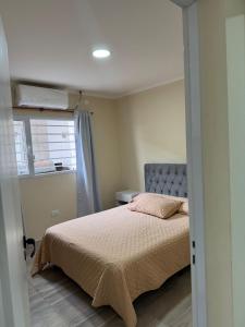 Ένα ή περισσότερα κρεβάτια σε δωμάτιο στο Depto para 4 personas