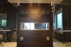 a bathroom with two sinks and a mirror at Paradise - Spacious, Ocean Views, Outdoor Living in Dodges Ferry +33 photos