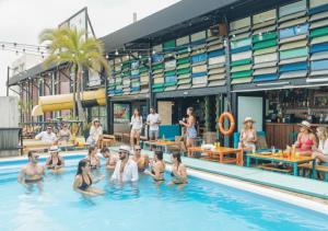 a group of people in a swimming pool at Mayan Monkey Cancun - Social Hotel in Cancún