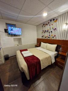 En eller flere senge i et værelse på All sur departamento