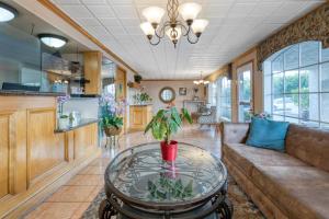 a living room with a couch and a table at SureStay Hotel by Best Western Camarillo in Camarillo