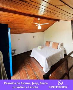 Giường trong phòng chung tại Pousada Bougain Ville Para-tí