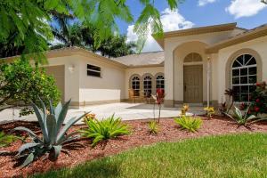 a villa with aiterranean style house with a driveway at Alecia in Cape Coral
