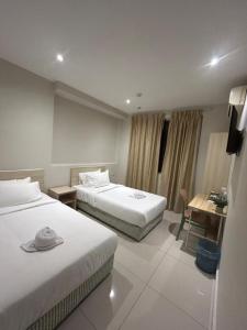 Giường trong phòng chung tại Swing & Pillows - Damansara Jaya +11 ảnh