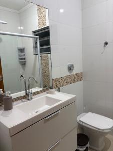 O baie la Apto centro 6 hóspedes com garagem