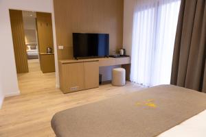 Sjónvarps- og/eða afþreyingartæki á Hotel Allegra