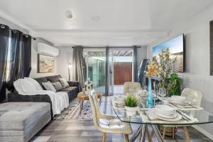 a living room with a table and a couch at Entire Private Home with 2 Bedrooms 1 Bathroom, Gated Yard, Driveway Parking, Available Now in Spring Valley