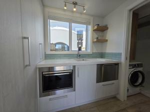 a kitchen with a sink and a window at Time Out in Pohara in Pohara +12 photos