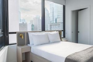Postel nebo postele na pokoji v ubytování Nomada Residences - District 225 + 56 fotografií