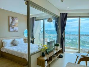 Postel nebo postele na pokoji v ubytování The Song Your Home Apartment - Căn Hộ Du Lịch 5 Sao Cạnh Biển + 95 fotografií