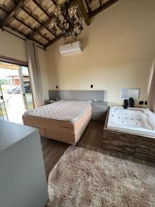 Postel nebo postele na pokoji v ubytování Sítio Mateus Leme