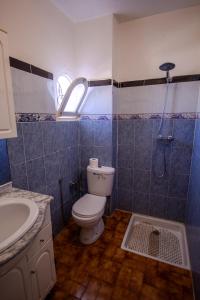 a bathroom with a toilet and a sink and a shower at Beachside Retreat in Imi ouadar in Agadir +21 photos