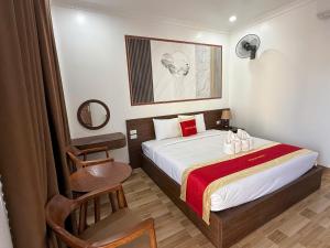 Postel nebo postele na pokoji v ubytování Avenue Hotel VangVieng + 48 fotografií