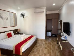 TV a/nebo společenská místnost v ubytování Avenue Hotel VangVieng