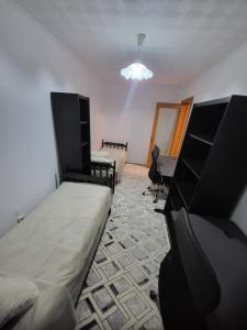 En eller flere senge i et værelse på Craiova Medicina APART