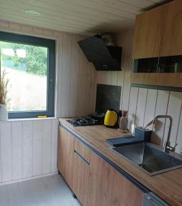 a kitchen with a sink and a counter top at Feeling Freedom in Tukhlya