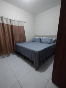 En eller flere senge i et værelse på Casa Blue