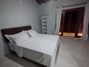 En eller flere senge i et værelse på Casa Blue