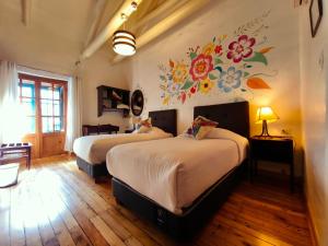 Ένα ή περισσότερα κρεβάτια σε δωμάτιο στο Cusco Lodge Hotel Boutique