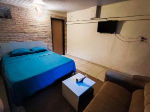 Ένα ή περισσότερα κρεβάτια σε δωμάτιο στο Hospedaje SKYHOME II