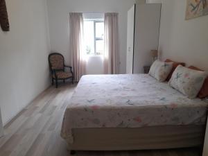 En eller flere senge i et værelse på Do-Little Farm Cottages