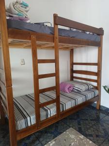 a couple of bunk beds in a room at Hostel Goiabeiras in Cuiabá +22 photos