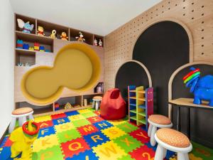 a childs play room with a toy elephant and a rug at Novotel Goa Panjim in Panaji