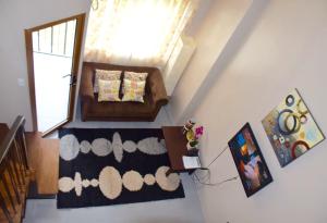 a living room with a couch and a window at Mondavi II Condo Unit 306 in Silang +34 photos