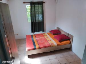 Ένα ή περισσότερα κρεβάτια σε δωμάτιο στο Appartement Ravine Vilaine