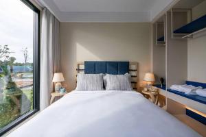 Postel nebo postele na pokoji v ubytování The Sóng - Tumys home